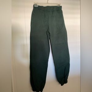woman’s dark green sweat pants